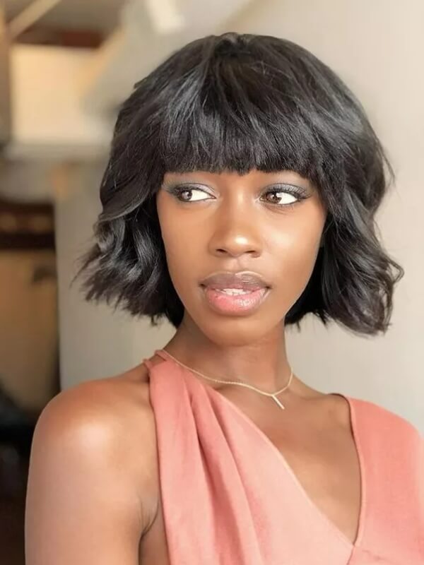 A sew-in is ideal for trying out a bold, voluminous bob with a full fringe