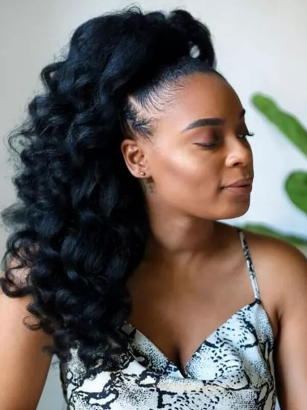 This style combines blow-out texture with a sew-in that allows hair to be styled up