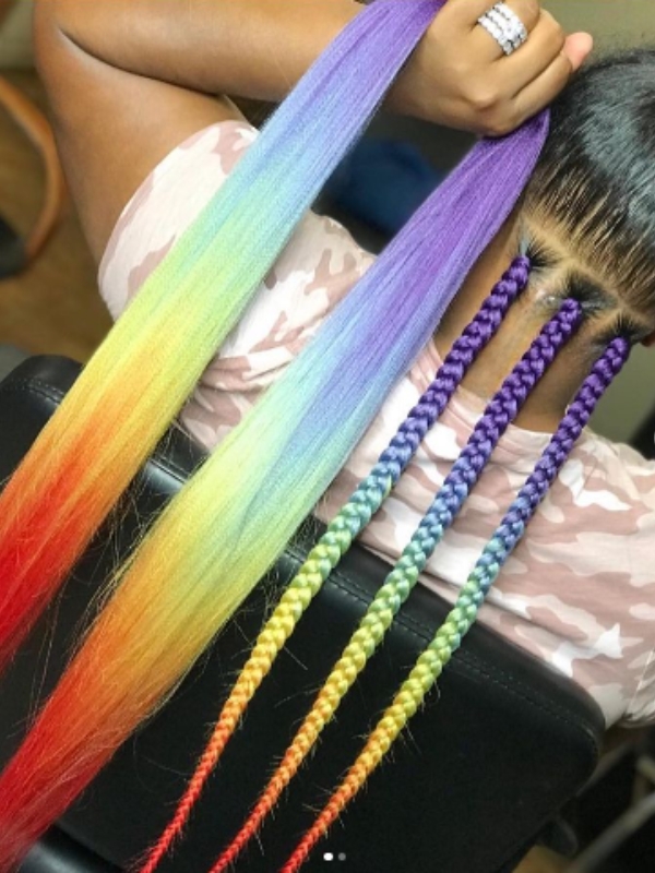 Rainbow peek a boo braids showcase hair sections in every color of the rainbow.